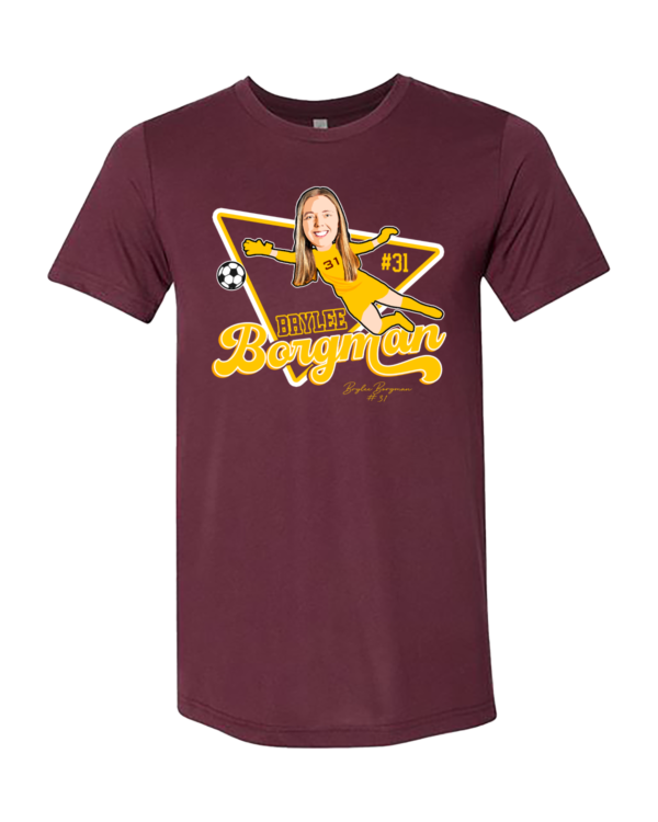 A maroon t-shirt with a picture of a person on it.