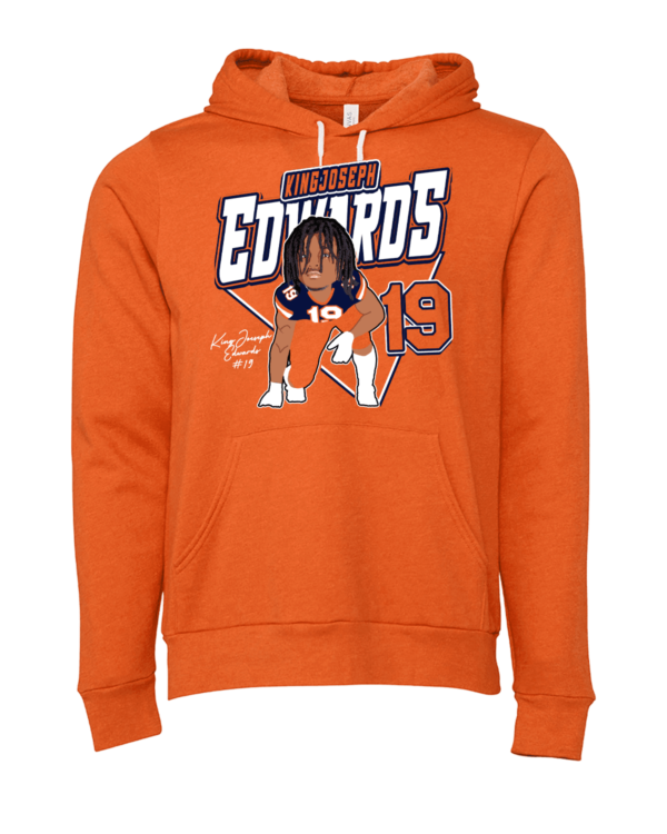 A person wearing an orange hoodie with the name of edwards on it.