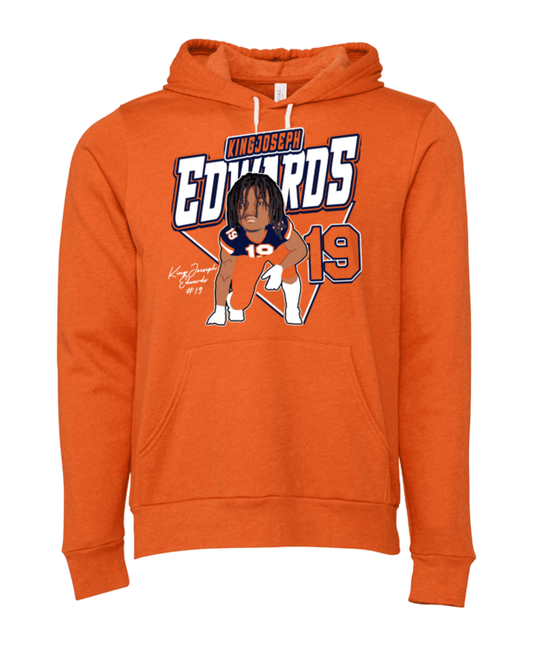 A person wearing an orange hoodie with the name of edwards on it.