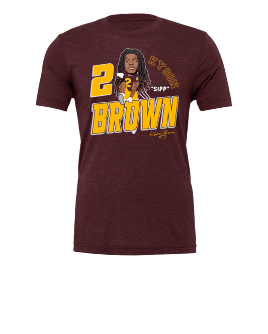 A maroon t-shirt with a picture of a man and the words " brown ".